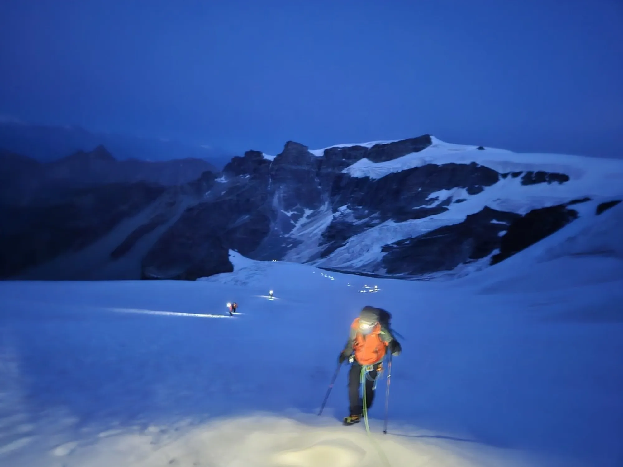 Out onto the glacier at 4:30 in full dark, roped to Emmanuel, trusting a man who could read a darkness I couldn't.